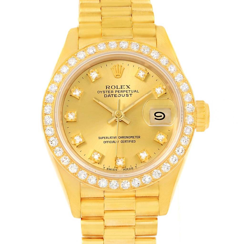 This is a front view of a Rolex President 69178 Women's Yellow Gold Champagne Dial 69178 Women's Yellow Gold Champagne Dial model, showcasing the gold dial, date window, and diamond-studded bezel and markers.