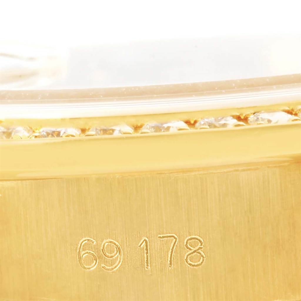 This close-up image shows the side of the bezel and case of a Rolex President 69178 Women's Yellow Gold Champagne Dial 69178 Women's Yellow Gold Champagne Dial model watch, highlighting its diamond setting and model number.