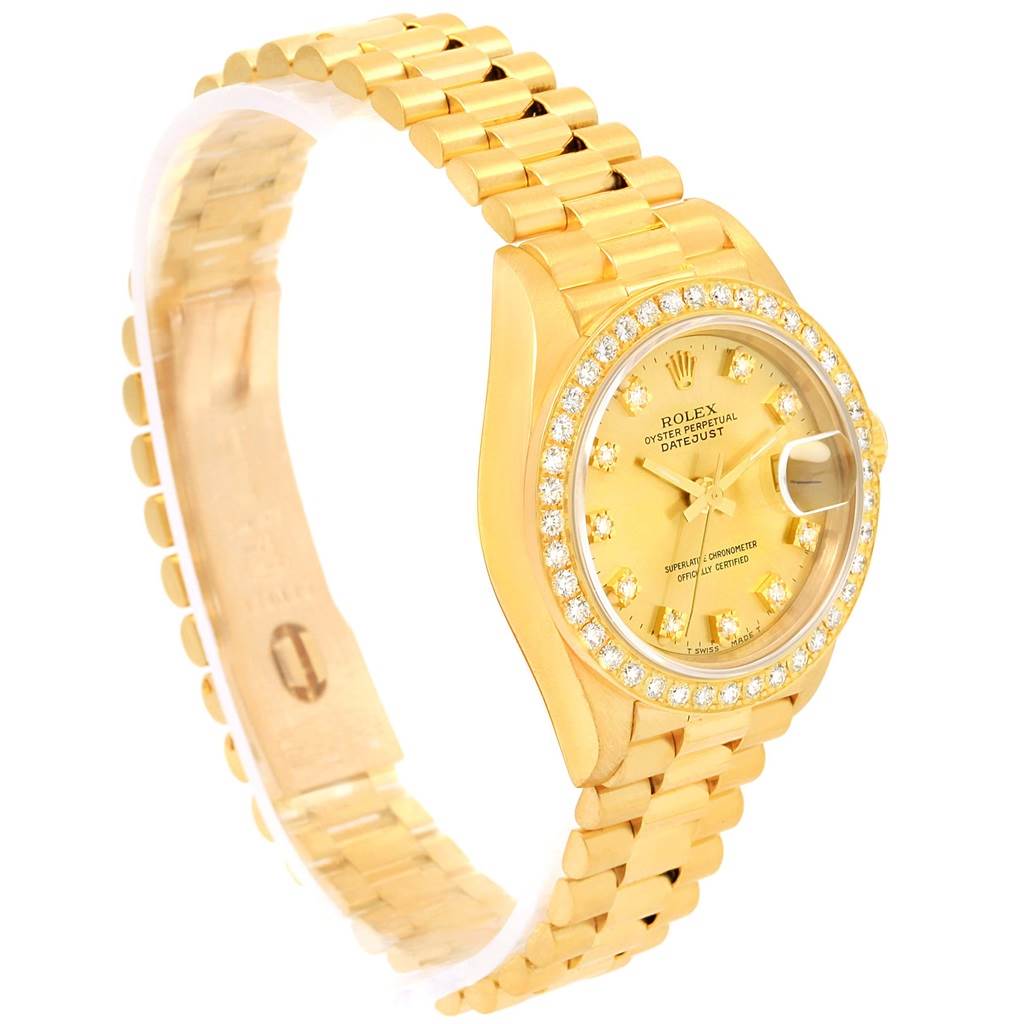 The Rolex President 69178 Women's Yellow Gold Champagne Dial 69178 Women's Yellow Gold Champagne Dial model watch is shown from an angled top view, displaying its gold bracelet, face, and diamond bezel.