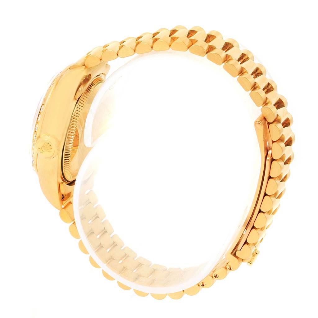 The Rolex President 79268 Women's Yellow Gold White Dial 79268 Women's Yellow Gold White Dial model watch is shown from a top-side angle, highlighting its gold case, crown, and bracelet links.