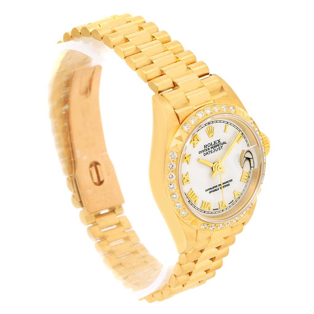 The Rolex President 79268 Women's Yellow Gold White Dial 79268 Women's Yellow Gold White Dial model watch is shown at a three-quarter angle, highlighting its gold bracelet and diamond-accented bezel.