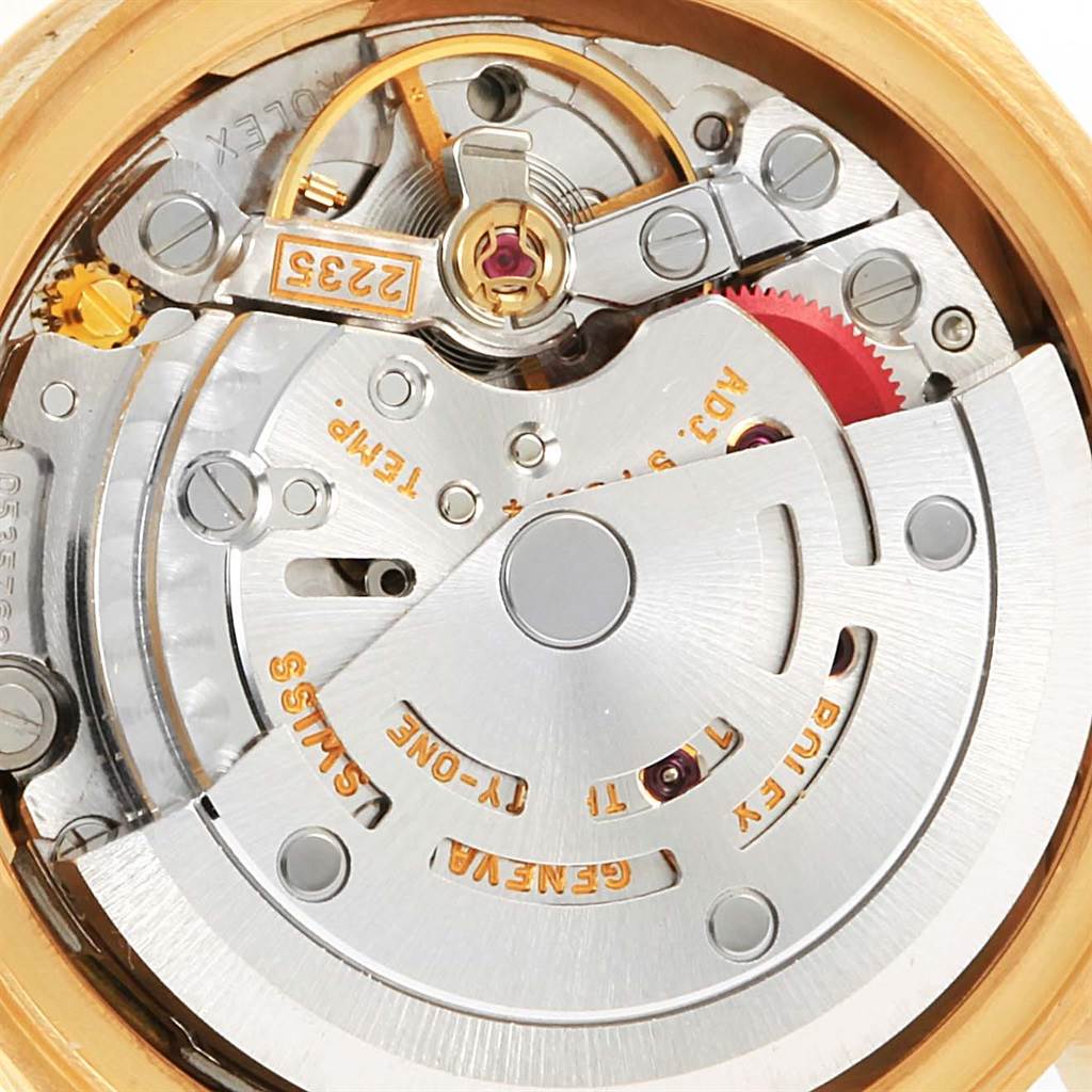 This image shows the intricate internal mechanical movement of a Rolex President 79268 Women's Yellow Gold White Dial 79268 Women's Yellow Gold White Dial model watch from a close-up angle.