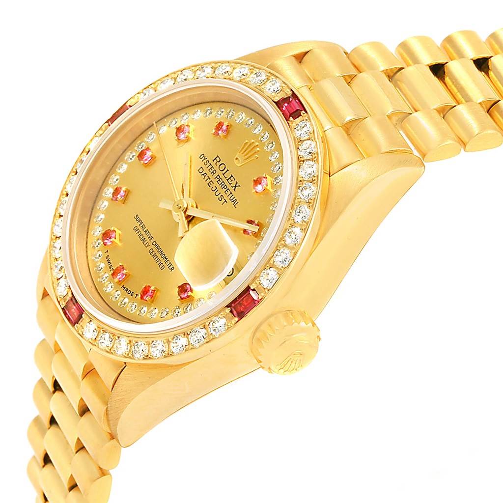 This image shows a side angle of the Rolex President 69178 Women's Yellow Gold Champagne Dial 69178 Women's Yellow Gold Champagne Dial model watch, highlighting its gold band, crown, dial, and diamond bezel.