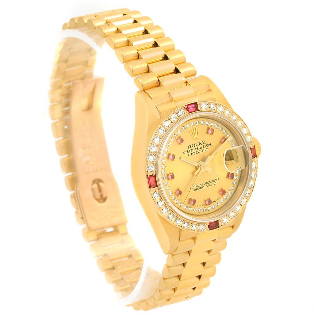 The image shows a side view of the Rolex President 69178 Women's Yellow Gold Champagne Dial 69178 Women's Yellow Gold Champagne Dial model watch, highlighting its gold bracelet, diamond-encrusted bezel, and dial.