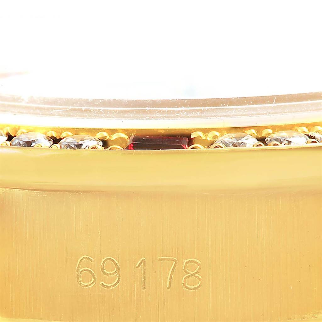 This close-up image shows the bezel, diamonds, and part of the case with model number 69178 on a Rolex President 69178 Women's Yellow Gold Champagne Dial 69178 Women's Yellow Gold Champagne Dial watch.