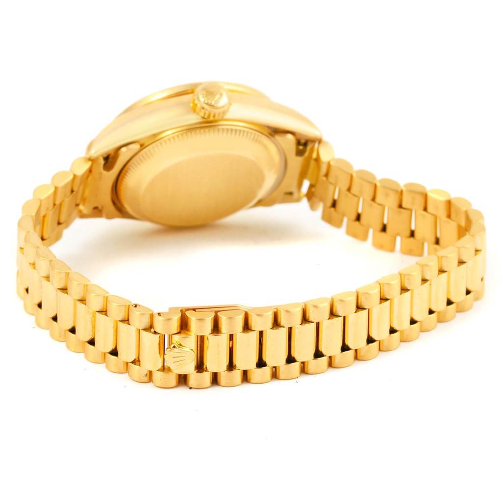 The image shows the backside and bracelet of a gold Rolex President 69178 Women's Yellow Gold Champagne Dial 69178 Women's Yellow Gold Champagne Dial model watch, focusing on the back case and clasp.