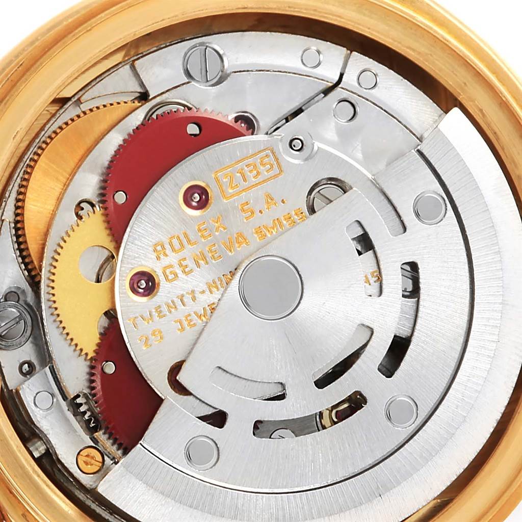 Shown is a close-up of the Rolex President 69178 Women's Yellow Gold Champagne Dial 69178 Women's Yellow Gold Champagne Dial model's movement, highlighting gears and internal mechanisms.