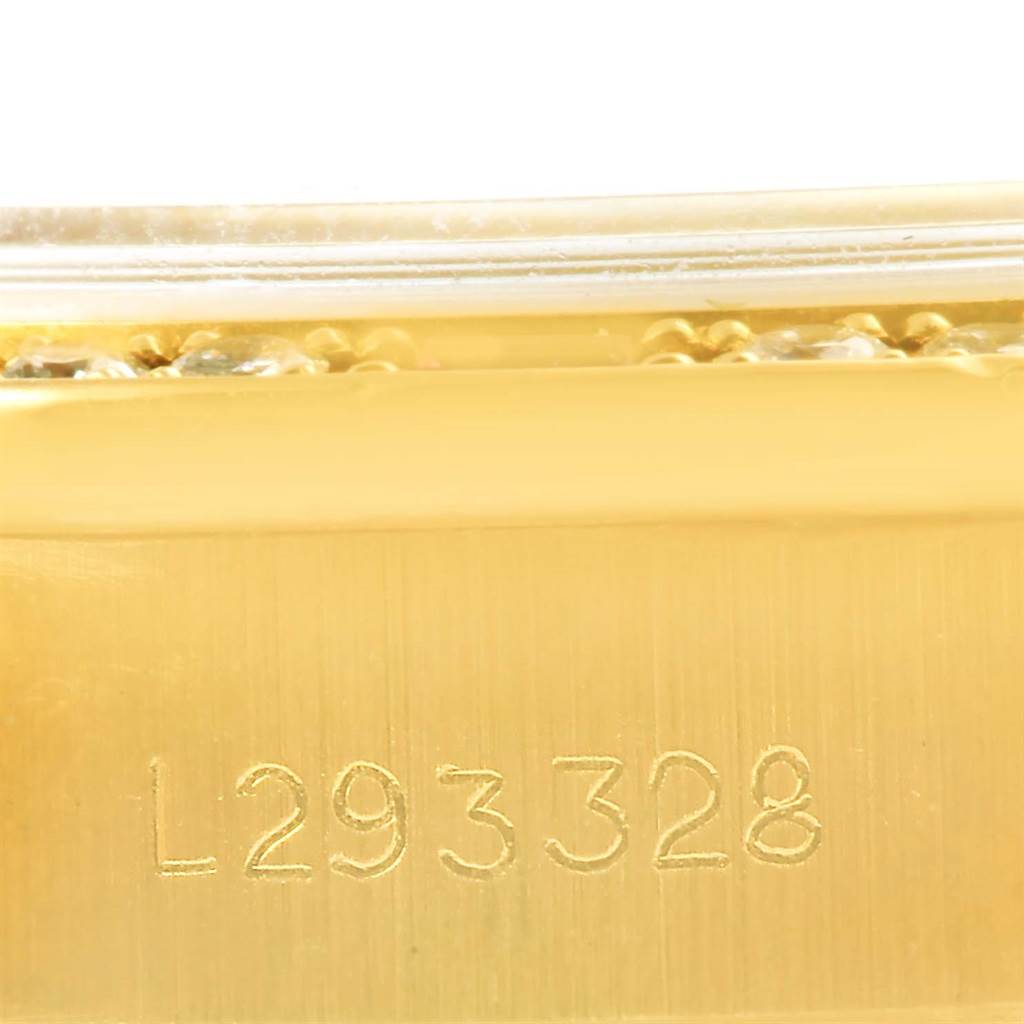 The image shows a close-up view of the serial number engraving on the gold case of a Rolex President 69178 Women's Yellow Gold Champagne Dial 69178 Women's Yellow Gold Champagne Dial model watch.