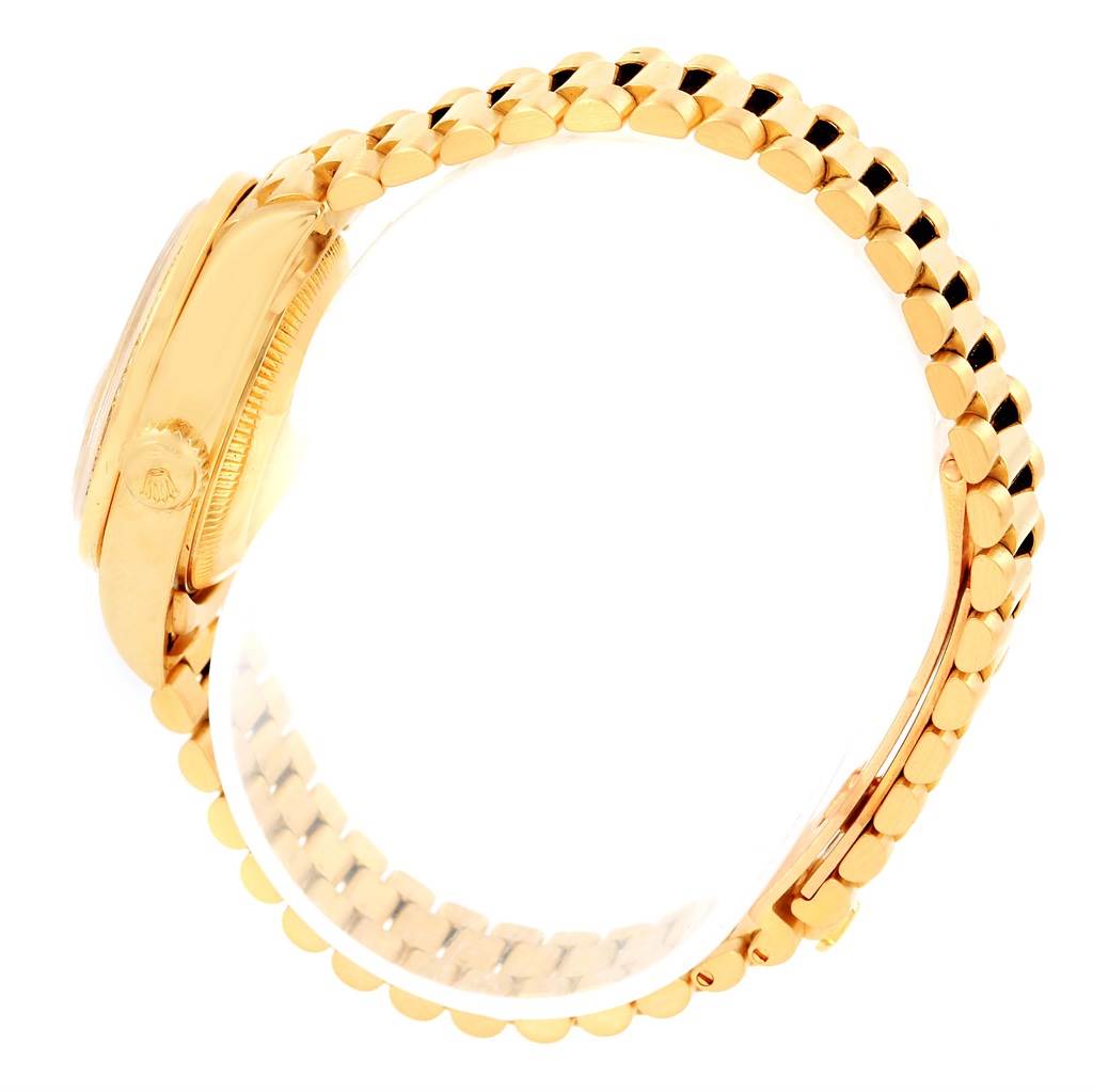 The image shows a side view of a gold Rolex President 69178 Women's Yellow Gold Champagne Dial 69178 Women's Yellow Gold Champagne Dial model watch, highlighting the band and part of the watch case.