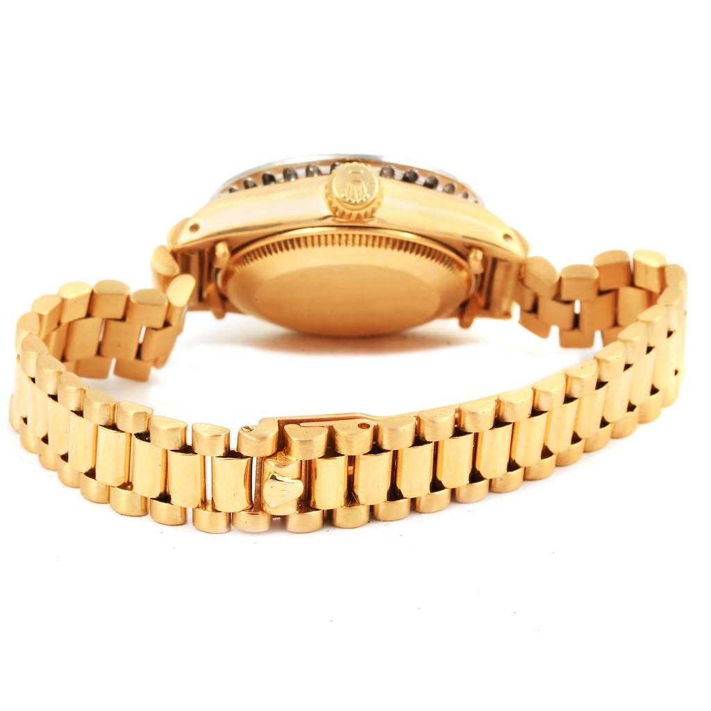 This image shows the back case and bracelet of a Rolex President 6917 Women's Yellow Gold Champagne Dial 6917 Women's Yellow Gold Champagne Dial model watch in gold.