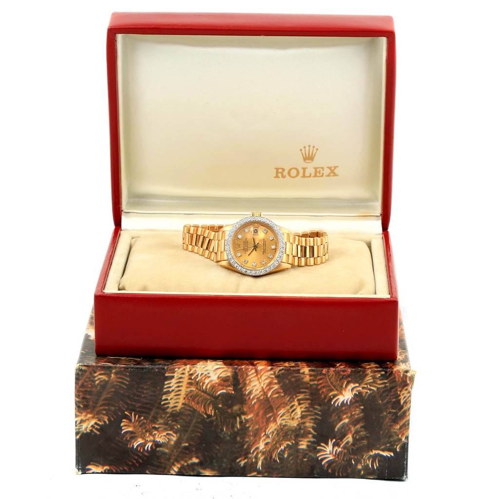 The Rolex President 6917 Women's Yellow Gold Champagne Dial 6917 Women's Yellow Gold Champagne Dial model watch is displayed front-facing in its open, branded box.
