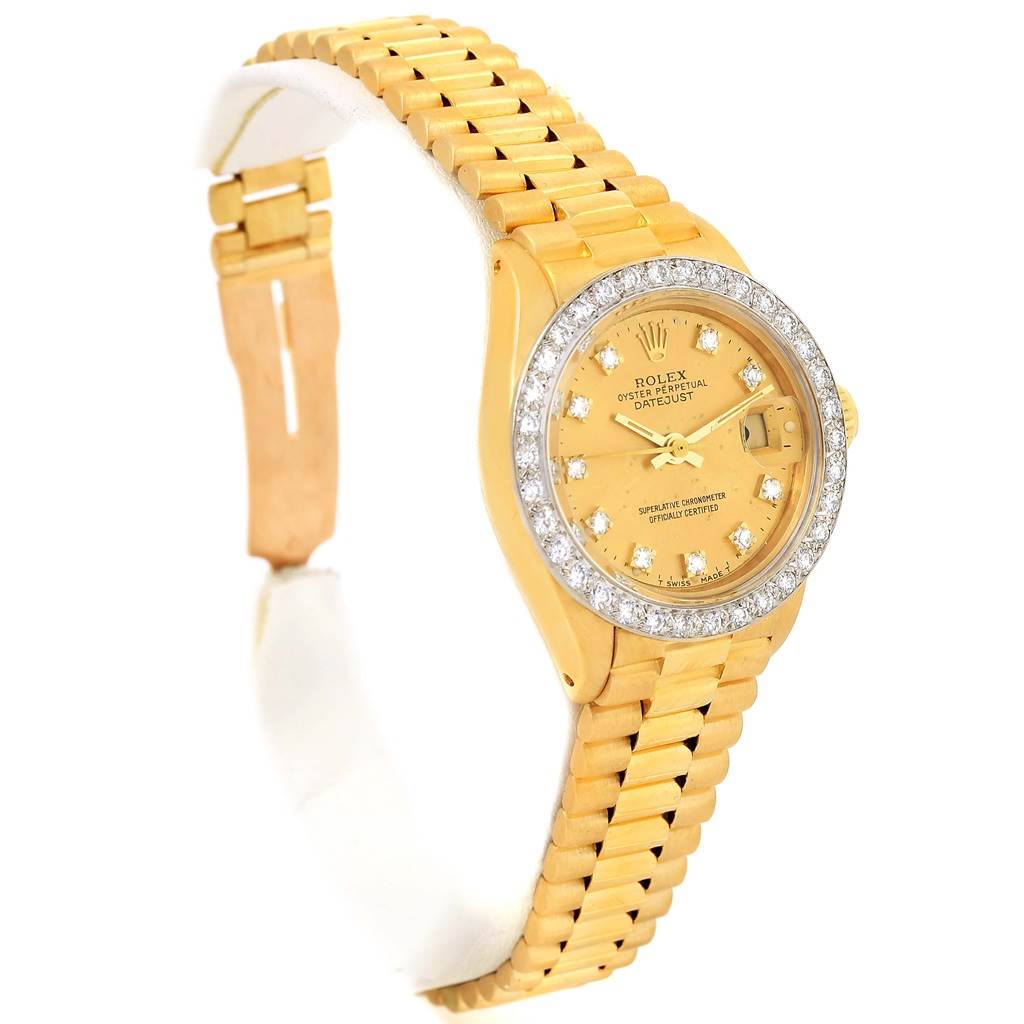 The image shows a Rolex President 6917 Women's Yellow Gold Champagne Dial 6917 Women's Yellow Gold Champagne Dial model watch from a side angle, displaying the band, dial, and diamond bezel.