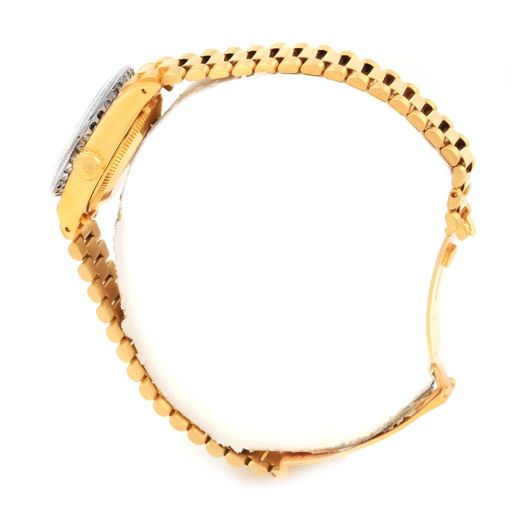 The image shows a Rolex President 6917 Women's Yellow Gold Champagne Dial 6917 Women's Yellow Gold Champagne Dial model watch from a side angle, highlighting the gold bracelet and partially visible watch case.