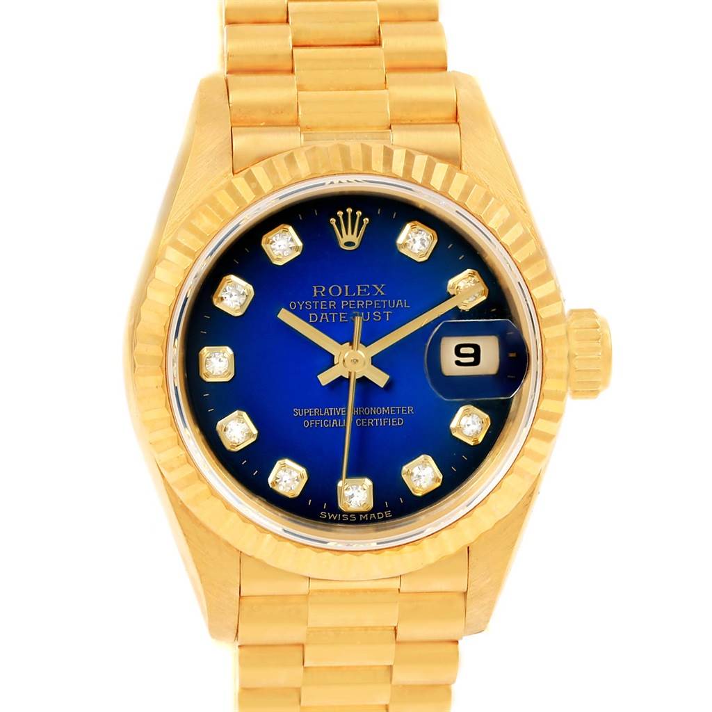 The image shows a frontal view of a Rolex President 69178 Women's Yellow Gold Blue Dial 69178 Women's Yellow Gold Blue Dial model watch, highlighting its gold band, blue dial, and date display.
