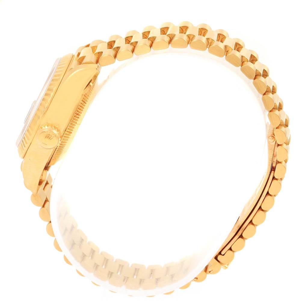 The image shows a side view of the Rolex President 69178 Women's Yellow Gold Blue Dial 69178 Women's Yellow Gold Blue Dial model watch, highlighting the gold case, crown, and gold bracelet links.