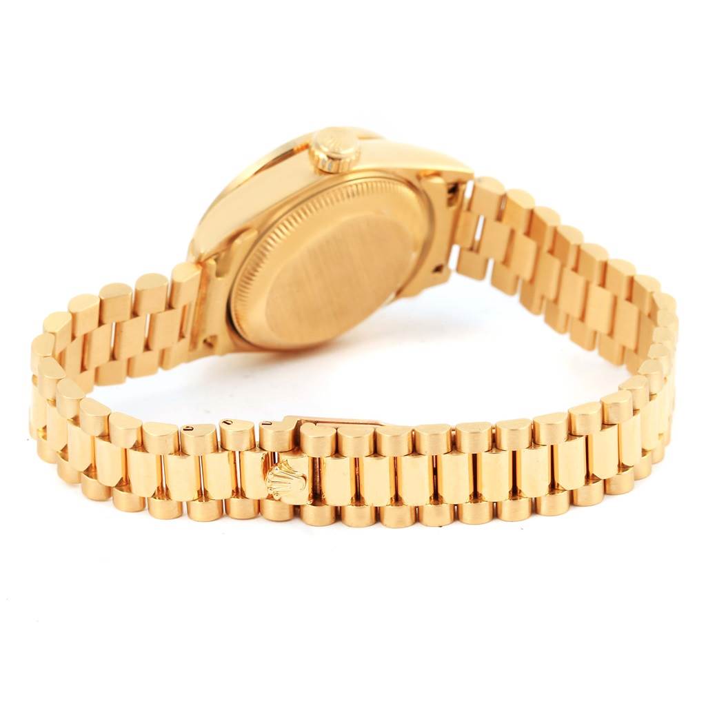 The image shows the back view and bracelet of a Rolex President 69178 Women's Yellow Gold Champagne Dial 69178 Women's Yellow Gold Champagne Dial model watch, featuring a gold finish.