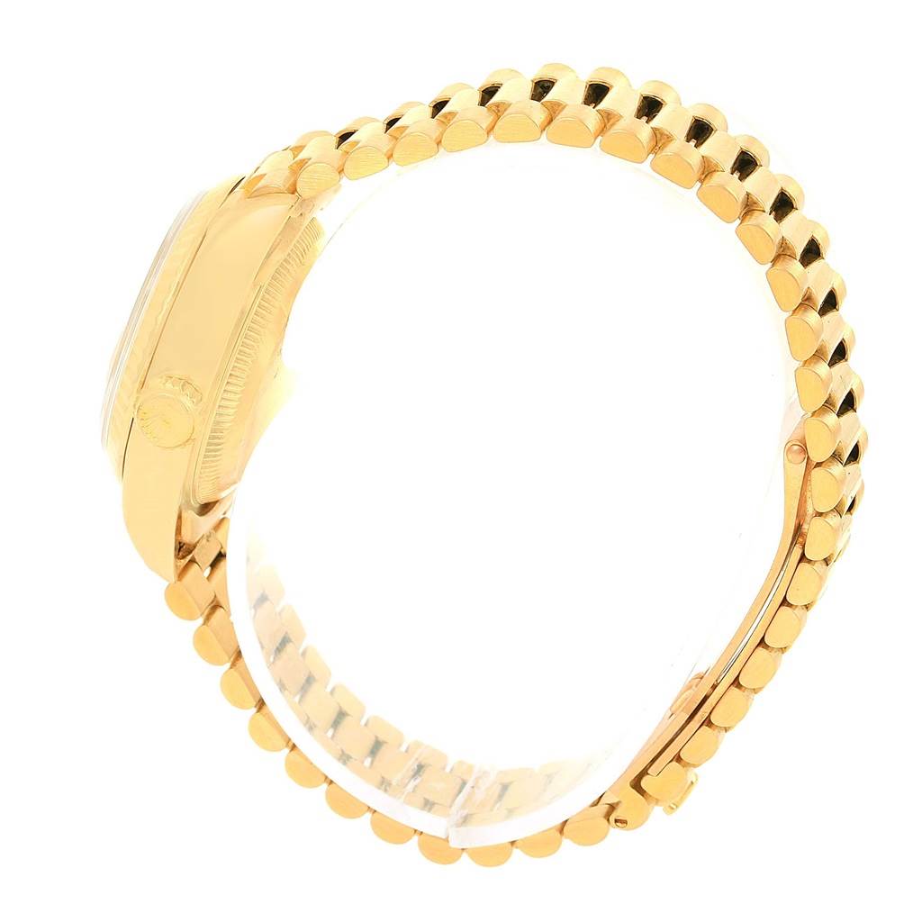 The image shows a side view of the Rolex President 69178 Women's Yellow Gold Champagne Dial 69178 Women's Yellow Gold Champagne Dial model, displaying the case and the bracelet.