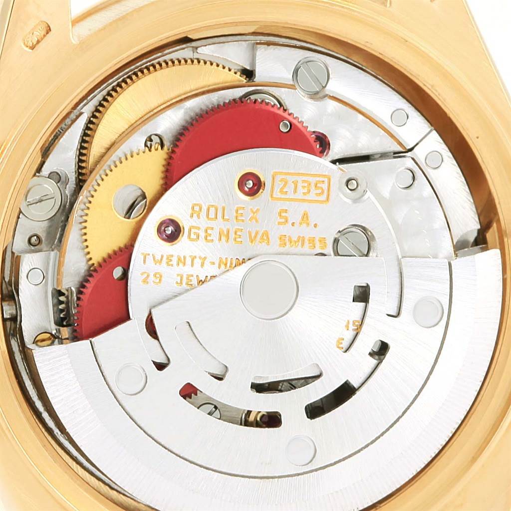 The image shows the intricate inner mechanics and movement of a Rolex President 69178 Women's Yellow Gold Champagne Dial 69178 Women's Yellow Gold Champagne Dial model watch from a rear angle.