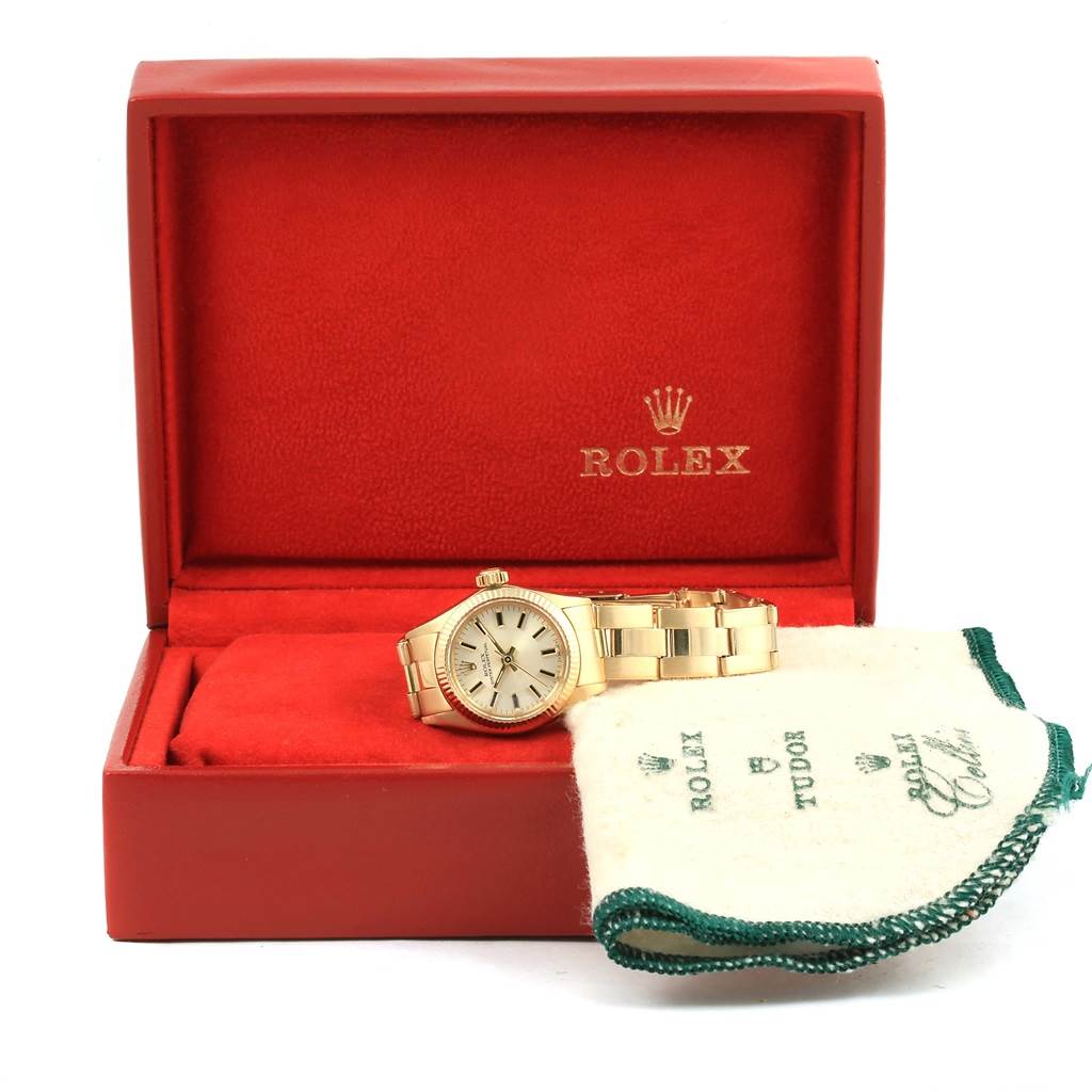 The image shows a Rolex President 6719 Women's Yellow Gold Silver Dial 6719 Women's Yellow Gold Silver Dial model watch in an open red Rolex box, accompanied by a cleaning cloth.