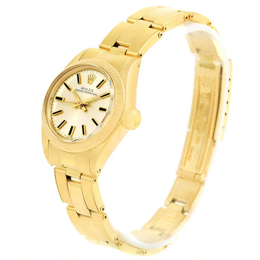 The image shows a full side view of a Rolex President 6719 Women's Yellow Gold Silver Dial 6719 Women's Yellow Gold Silver Dial model watch, highlighting its gold bracelet, dial, and crown.