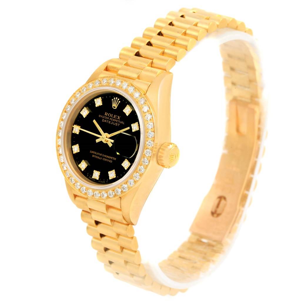 The image shows a Rolex President 69138 Women's Yellow Gold Black Dial 69138 Women's Yellow Gold Black Dial model watch from a three-quarter angle, highlighting its bracelet, bezel, dial, and crown.