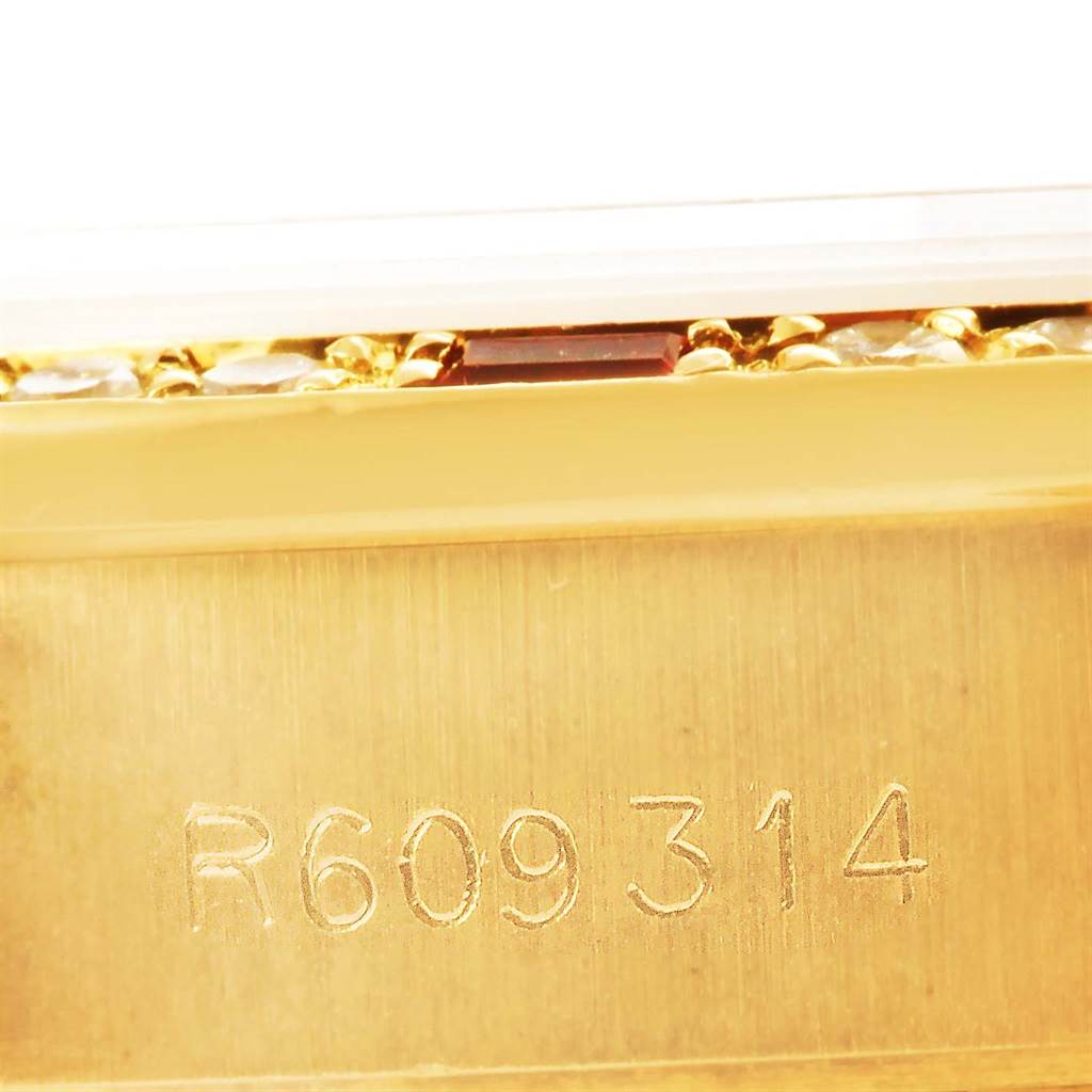 This image shows a close-up of the serial number "R609314" engraved on the gold casing of a Rolex President 69178 Women's Yellow Gold Champagne Dial 69178 Women's Yellow Gold Champagne Dial model watch.