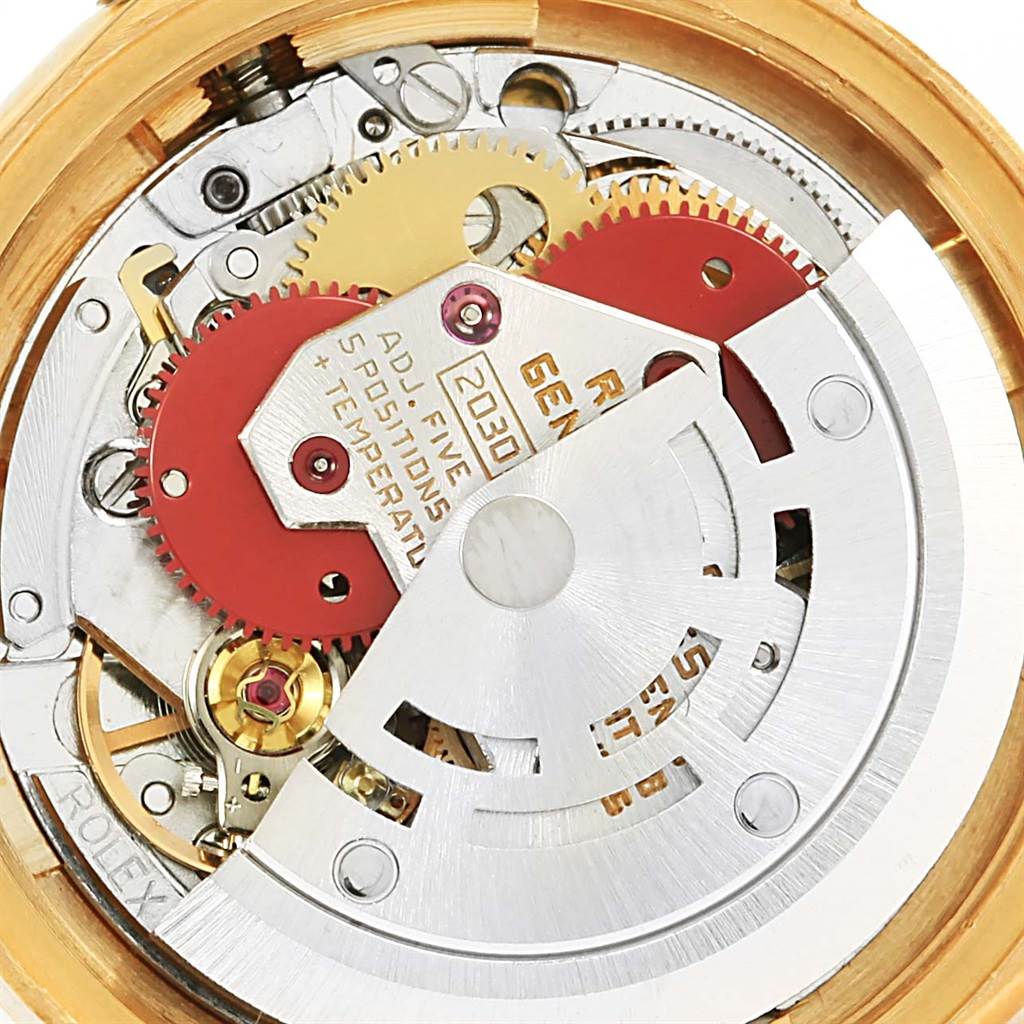 This image shows the internal movement mechanism of a Rolex President 6917 Women's Yellow Gold Champagne Dial 6917 Women's Yellow Gold Champagne Dial model watch, highlighting gears and components.