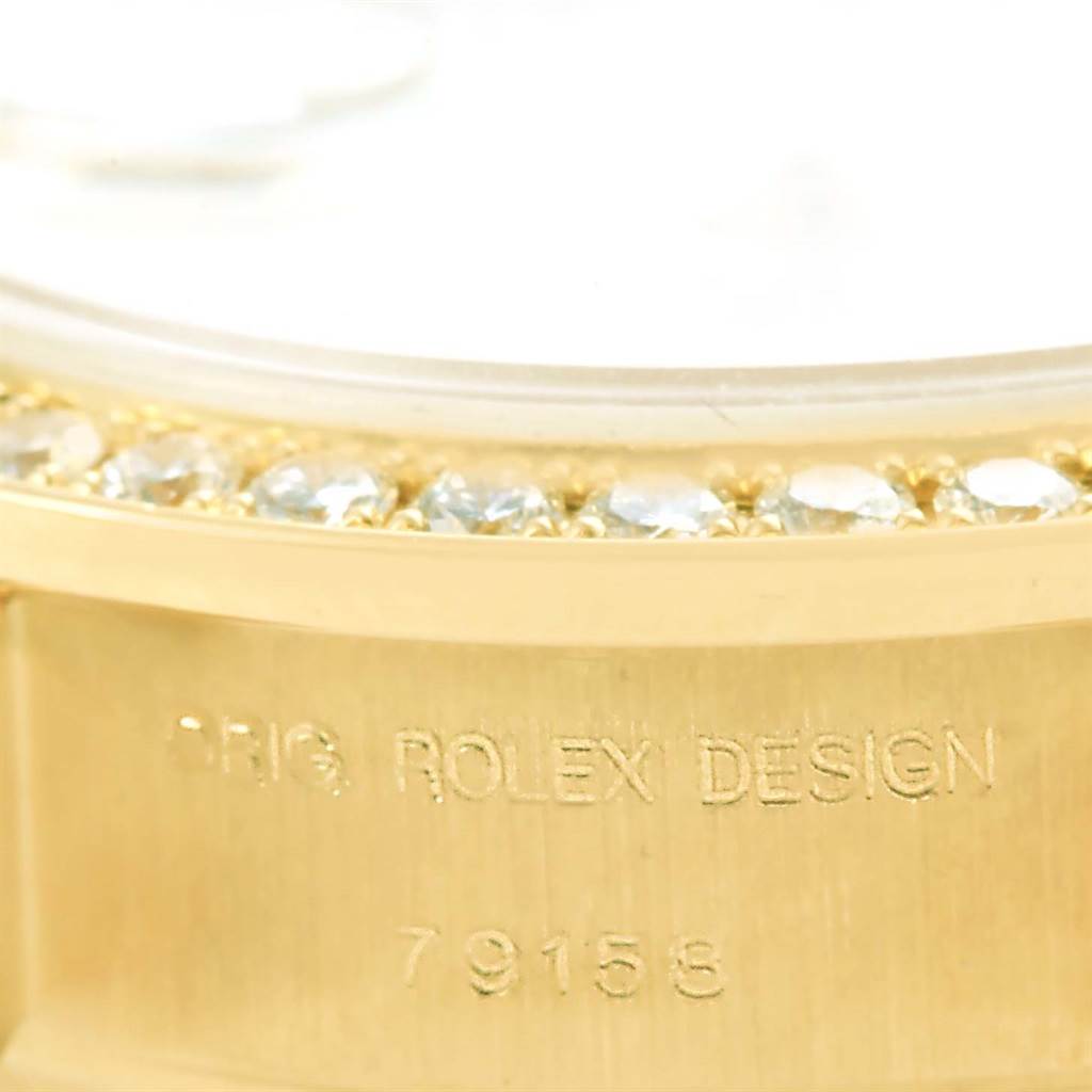 This close-up image shows the side of the Rolex President 79158 Women's Yellow Gold Mother of Pearl Dial 79158 Women's Yellow Gold Mother of Pearl Dial watch, featuring its gold casing and diamond bezel.