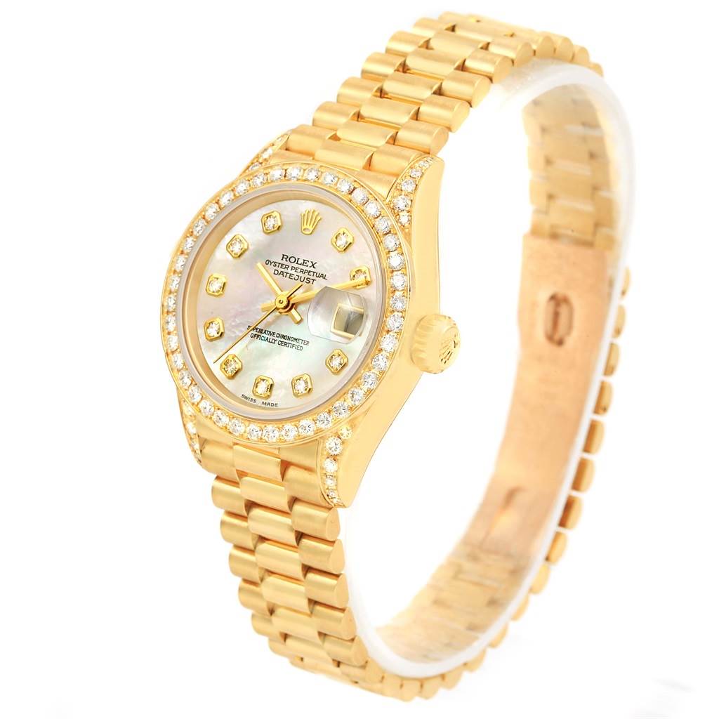 This image shows a Rolex President 79158 Women's Yellow Gold Mother of Pearl Dial 79158 Women's Yellow Gold Mother of Pearl Dial model watch at a slight angle, highlighting its gold casing, diamond bezel, and bracelet.