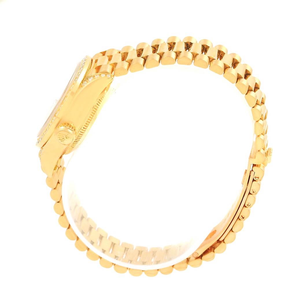 The image shows a side view of a Rolex President 79158 Women's Yellow Gold Mother of Pearl Dial 79158 Women's Yellow Gold Mother of Pearl Dial model watch, featuring the crown, case, and bracelet.