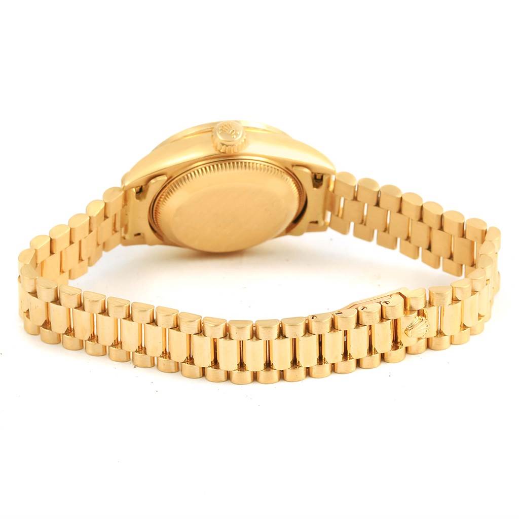 The image shows the back case and bracelet of a Rolex President 79158 Women's Yellow Gold Mother of Pearl Dial 79158 Women's Yellow Gold Mother of Pearl Dial model watch, with a focus on the link design.