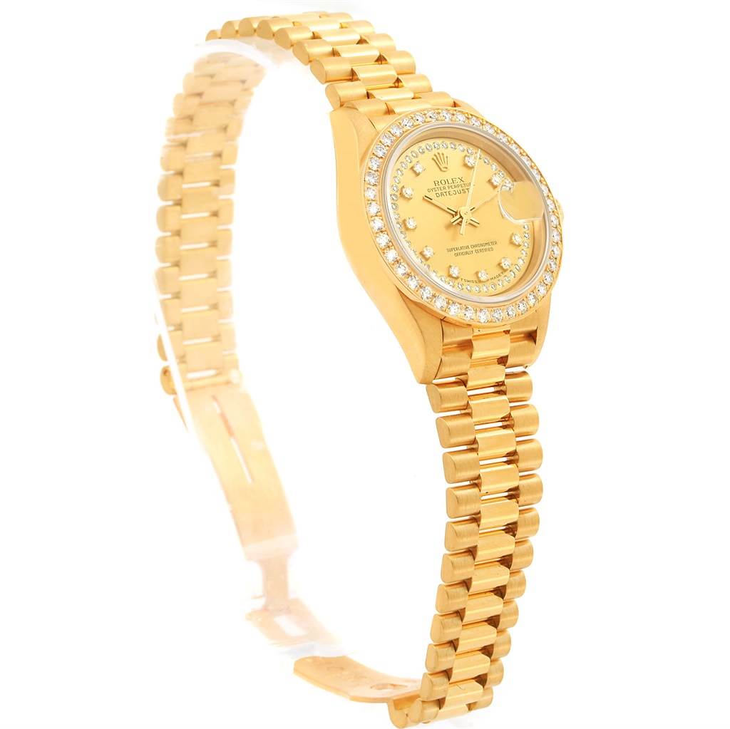 The image shows a Rolex President 69138 Women's Yellow Gold Champagne Dial 69138 Women's Yellow Gold Champagne Dial model watch from a side angle, highlighting the gold band and diamond-encrusted bezel.