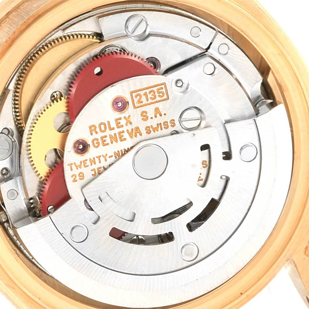The image shows the internal mechanical movement of a Rolex President 69178 Women's Yellow Gold Champagne Dial 69178 Women's Yellow Gold Champagne Dial model watch, highlighting gears and the rotor.