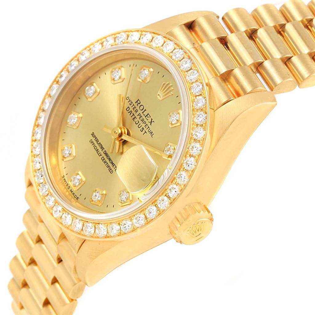 This image shows a close-up angled view of the Rolex President 69178 Women's Yellow Gold Champagne Dial 69178 Women's Yellow Gold Champagne Dial model watch, displaying its dial, diamond bezel, and part of the bracelet.