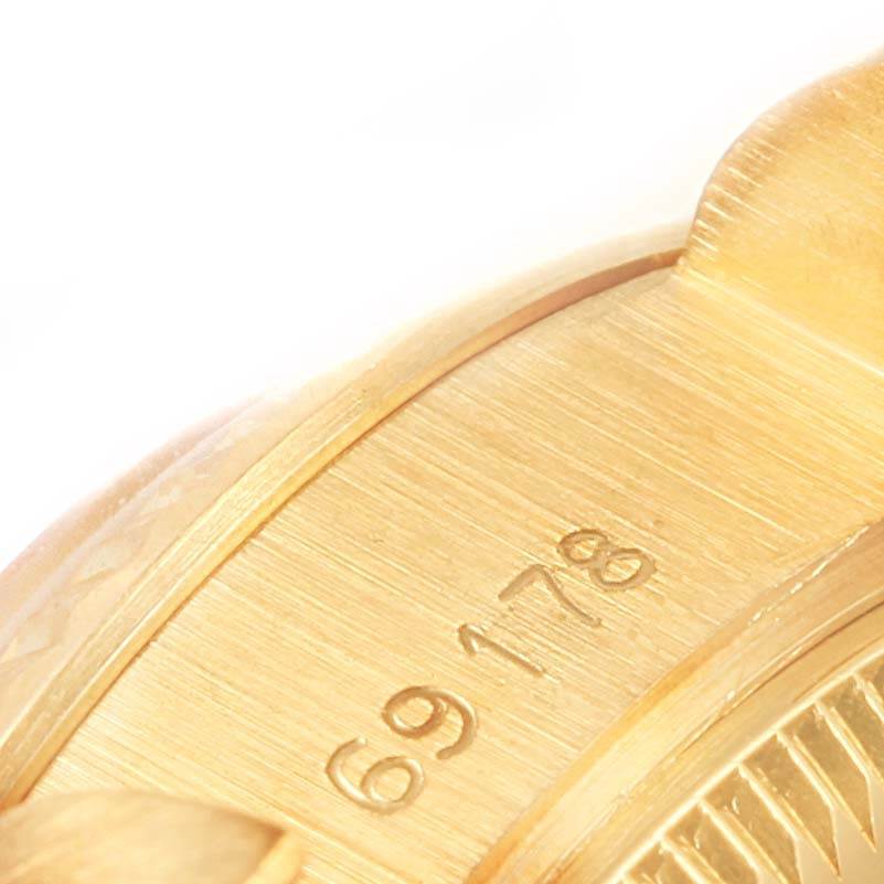 This close-up shows the case side with the model number of the Rolex President 69178 Women's Yellow Gold White Dial 69178 Women's Yellow Gold White Dial watch.