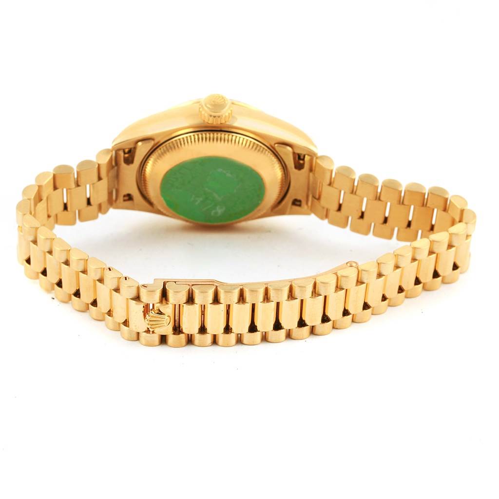 This image shows the back view of a Rolex President 69178 Women's Yellow Gold White Dial 69178 Women's Yellow Gold White Dial model watch, displaying its case back and gold bracelet.