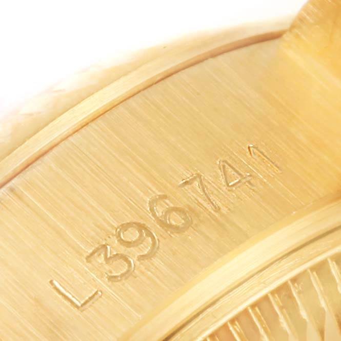 This image shows the case back and serial number of a Rolex President 69178 Women's Yellow Gold White Dial 69178 Women's Yellow Gold White Dial model watch, photographed at an angle.