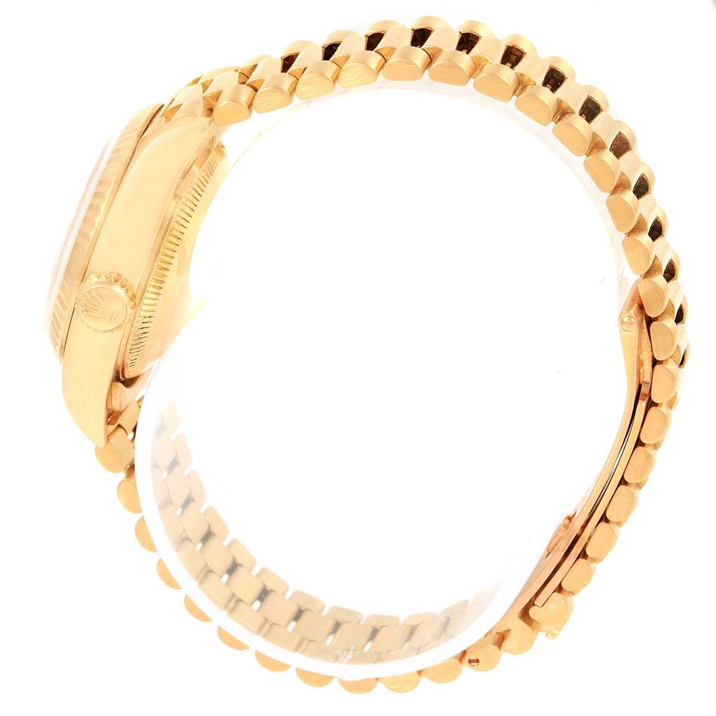 The image shows a side view of a Rolex President 69178 Women's Yellow Gold White Dial 69178 Women's Yellow Gold White Dial model watch, highlighting its gold case and President bracelet.