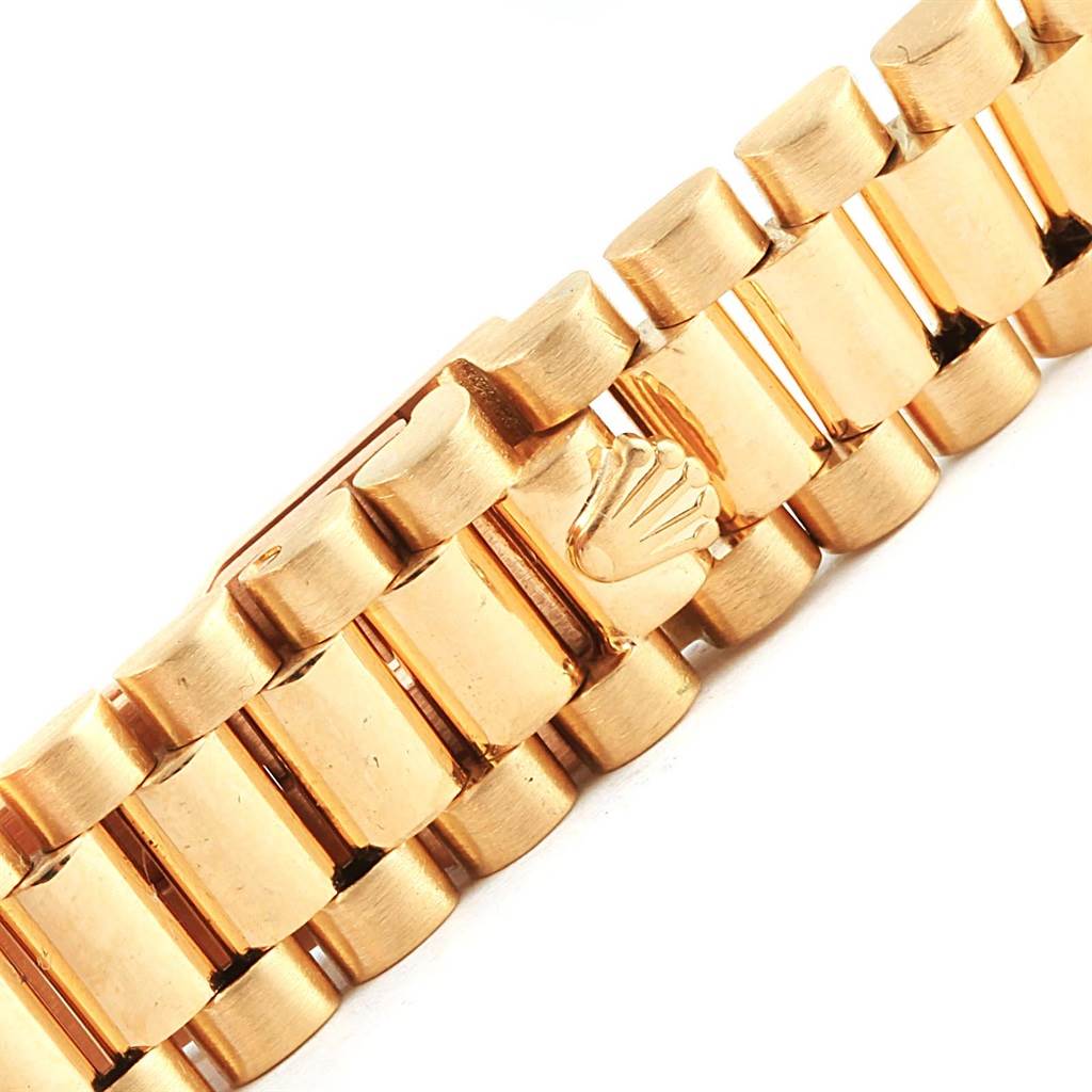 The image shows the gold bracelet clasp of a Rolex President 69178 Women's Yellow Gold White Dial 69178 Women's Yellow Gold White Dial model watch at a close-up angle.