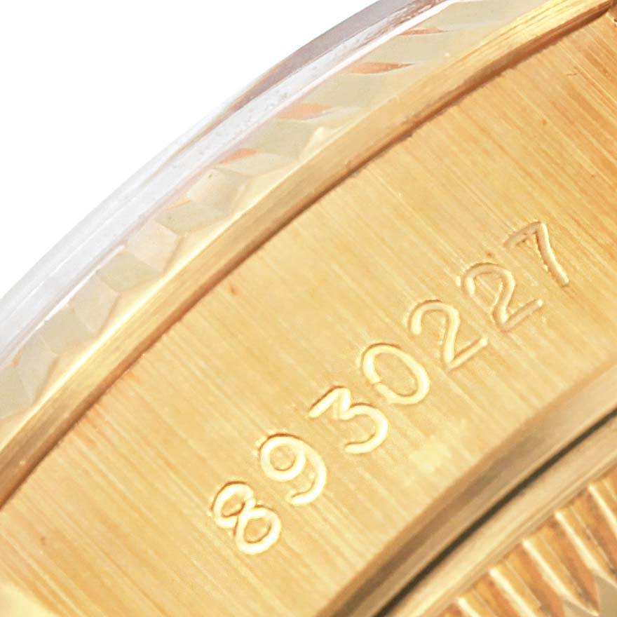This image shows a close-up of the gold outer edge and engraved serial number of the Rolex President 69178 Women's Yellow Gold White Dial 69178 Women's Yellow Gold White Dial model watch.