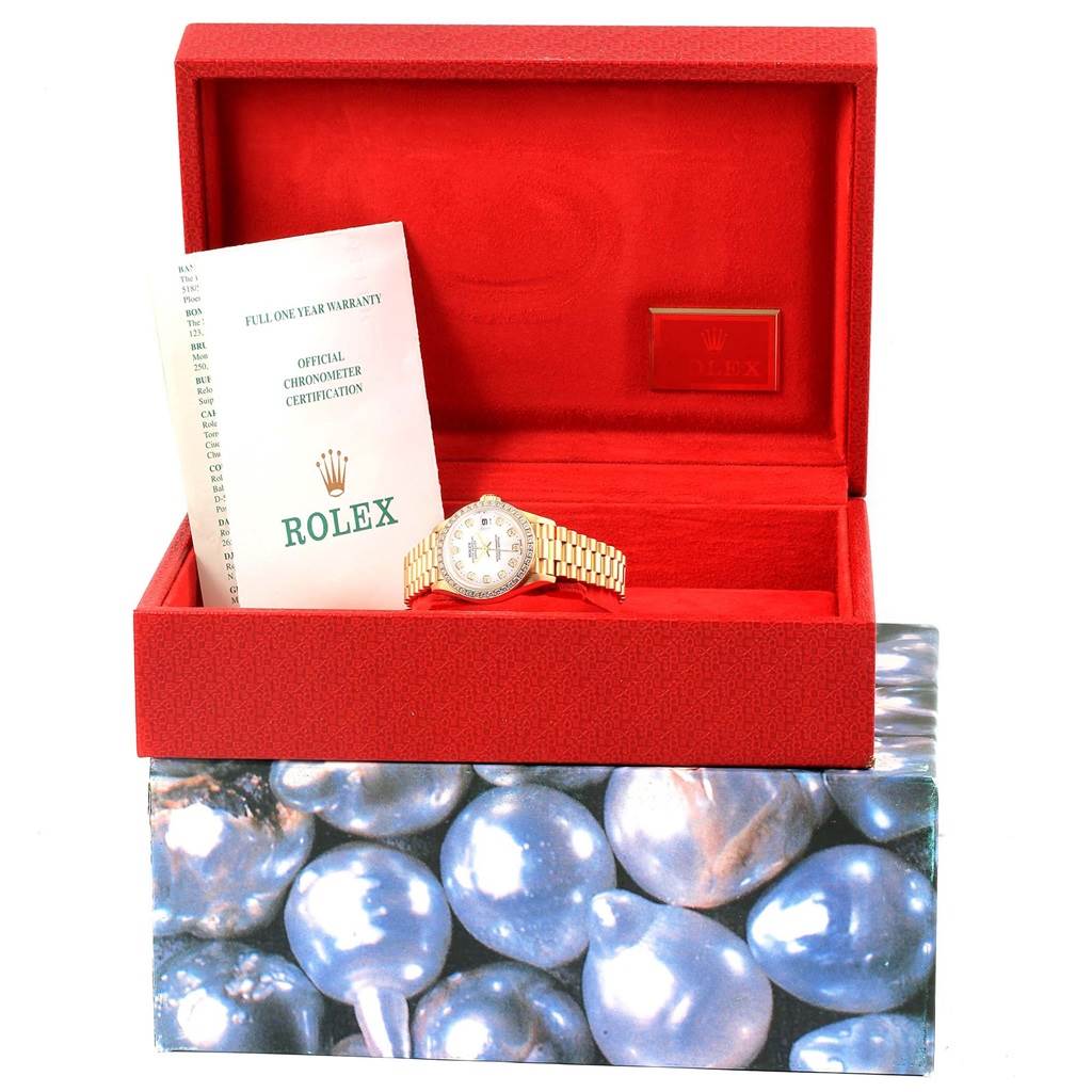 The Rolex President 69138 Women's Yellow Gold White Dial 69138 Women's Yellow Gold White Dial watch is showcased in an open box, accompanied by documentation and a warranty card.