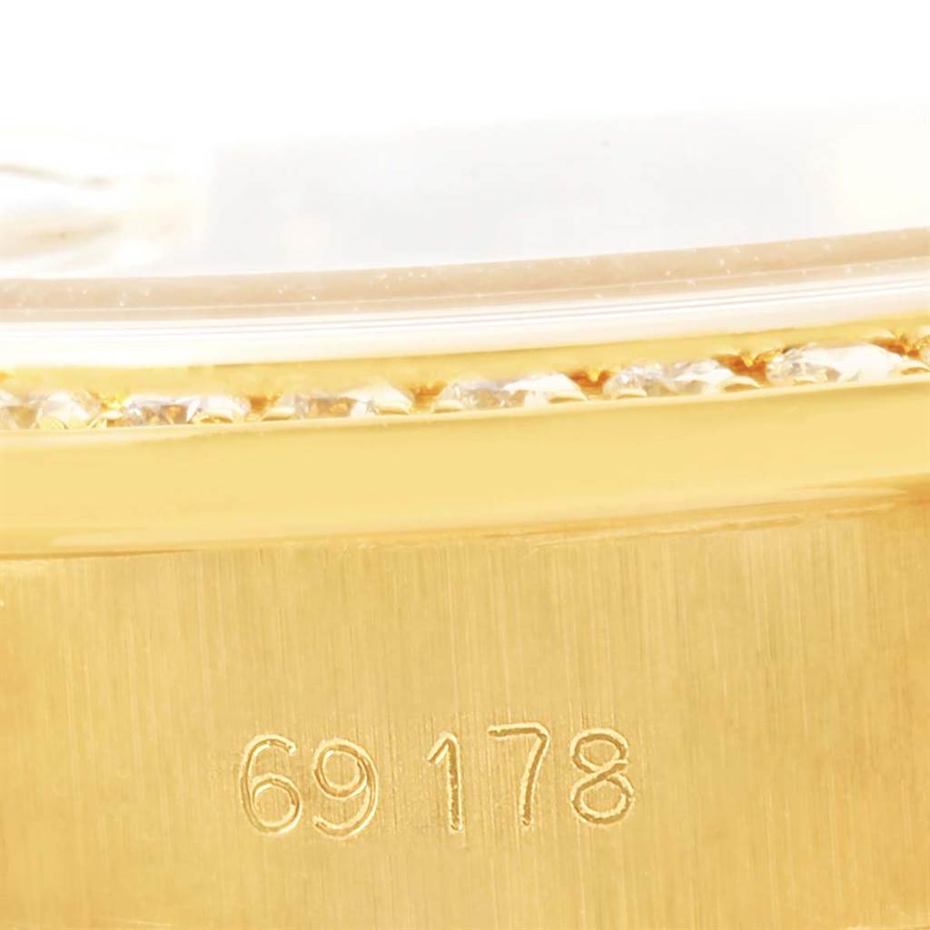 This image shows a close-up of the gold casing with diamonds and the model number "69178" engraved on a Rolex President 69178 Women's Yellow Gold Champagne Dial 69178 Women's Yellow Gold Champagne Dial watch.