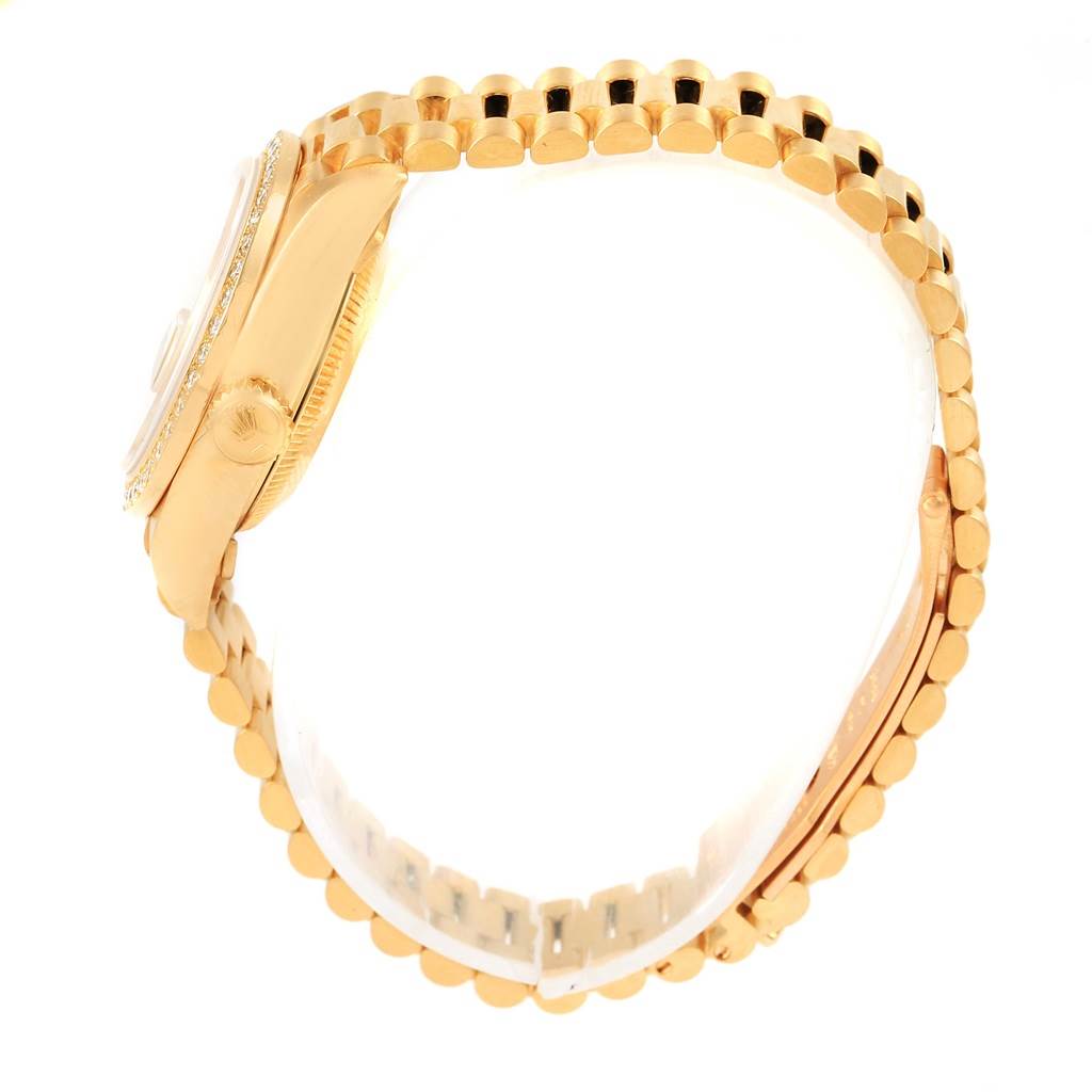 The Rolex President 69178 Women's Yellow Gold Champagne Dial 69178 Women's Yellow Gold Champagne Dial watch is shown from the side angle, highlighting the crown, case, and bracelet.