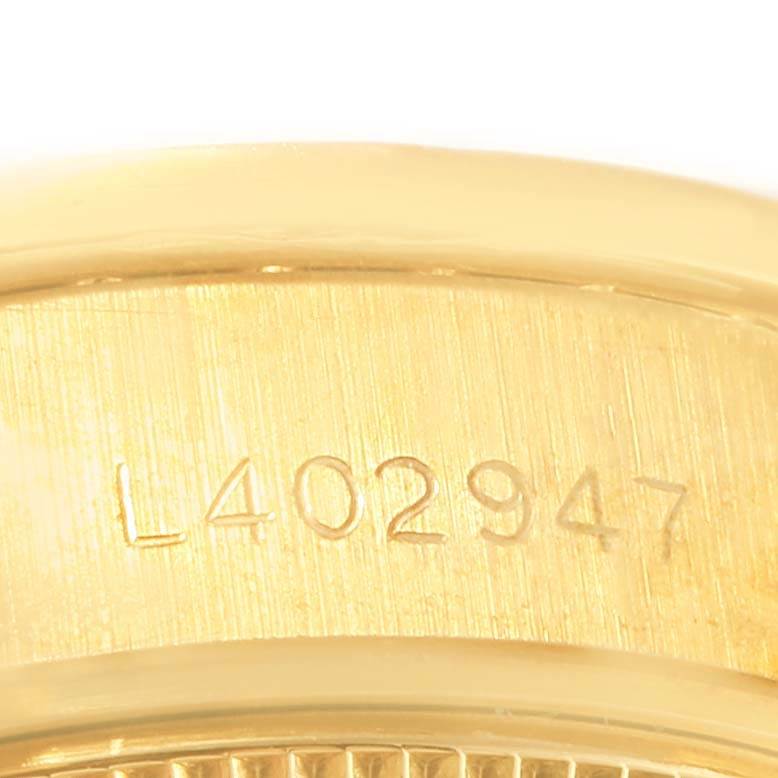 The image shows a close-up of the case side with the serial number of a Rolex President 69178 Women's Yellow Gold Champagne Dial 69178 Women's Yellow Gold Champagne Dial model watch.