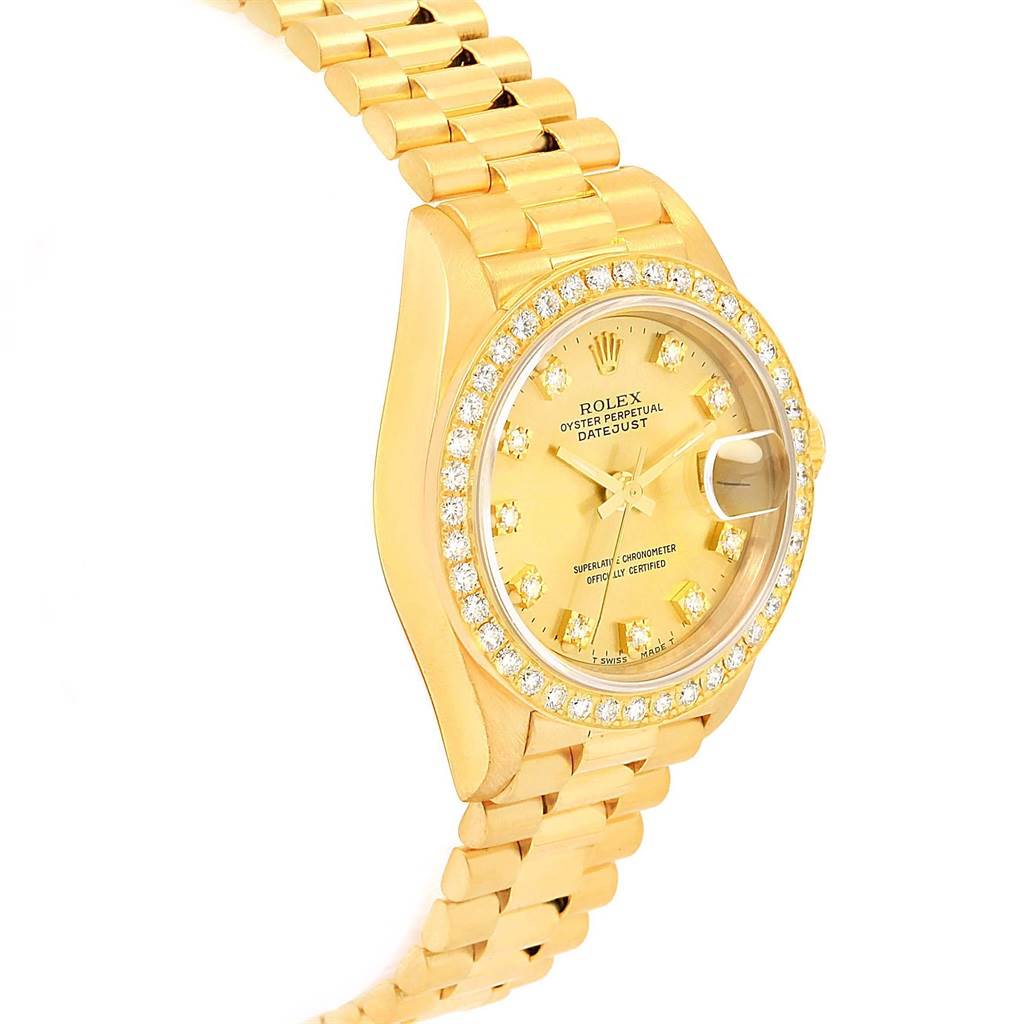 The image shows a Rolex President 69178 Women's Yellow Gold Champagne Dial 69178 Women's Yellow Gold Champagne Dial model watch at a slight angle, highlighting its gold band, diamond bezel, and detailed dial.