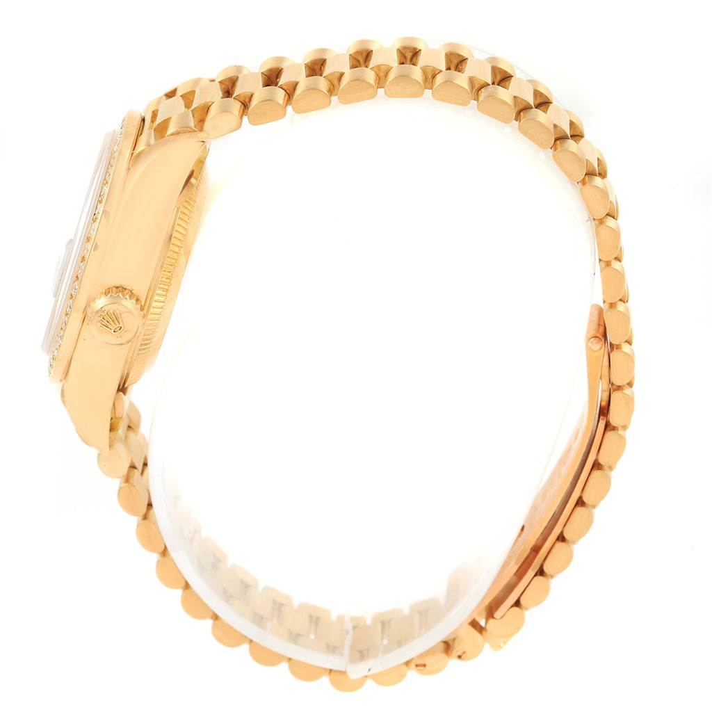 This side view shows the case, crown, bezel, and part of the bracelet of the Rolex President 79138 Women's Yellow Gold Mother of Pearl Dial 79138 Women's Yellow Gold Mother of Pearl Dial model watch.