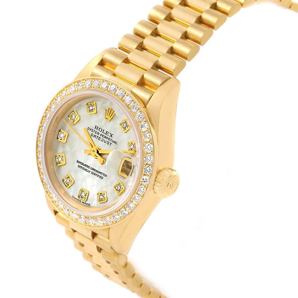 This image of the Rolex President 79138 Women's Yellow Gold Mother of Pearl Dial 79138 Women's Yellow Gold Mother of Pearl Dial model watch shows a side angle, highlighting the dial, bezel, crown, and bracelet.