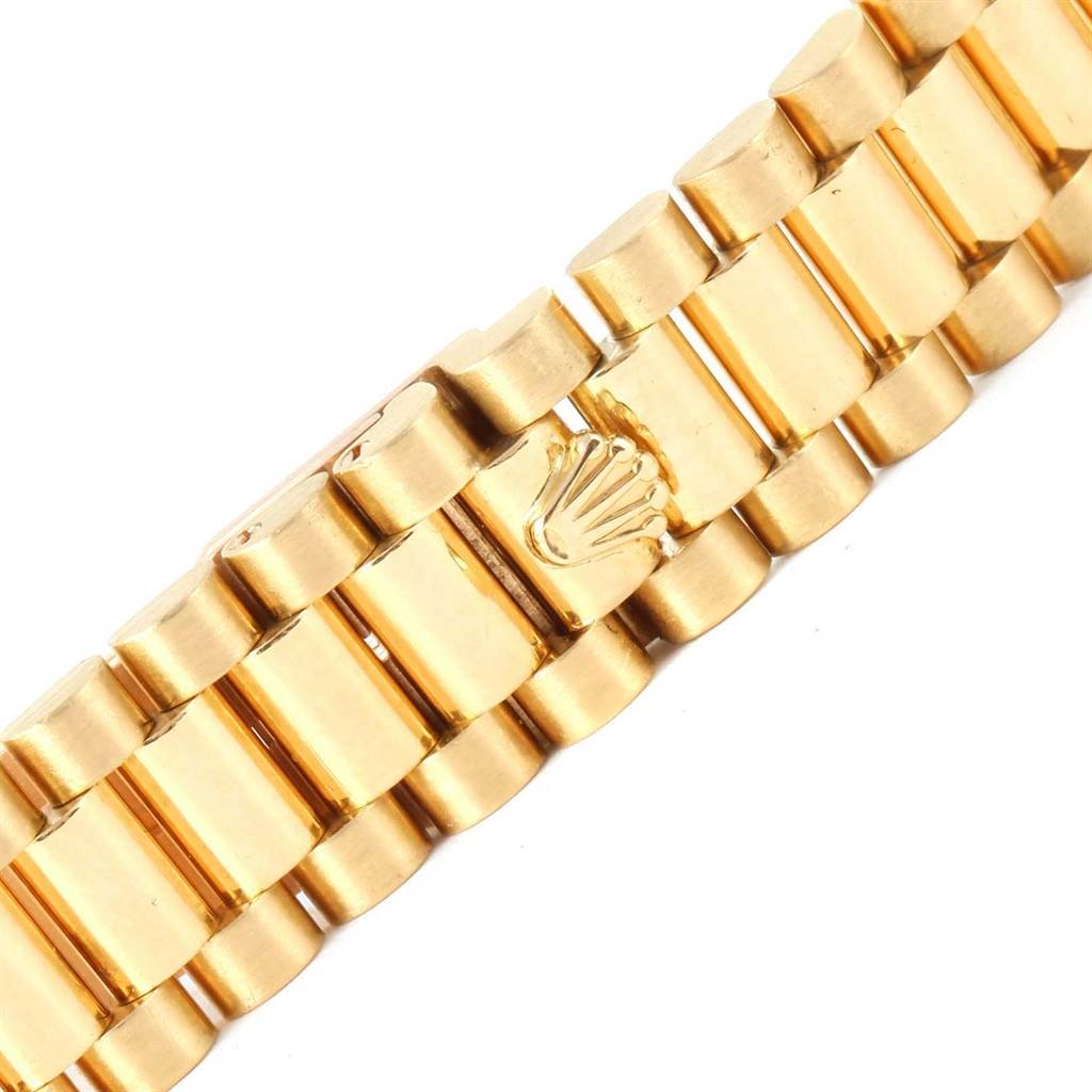 This image shows a close-up of the gold bracelet of a Rolex President 79138 Women's Yellow Gold Mother of Pearl Dial 79138 Women's Yellow Gold Mother of Pearl Dial watch.