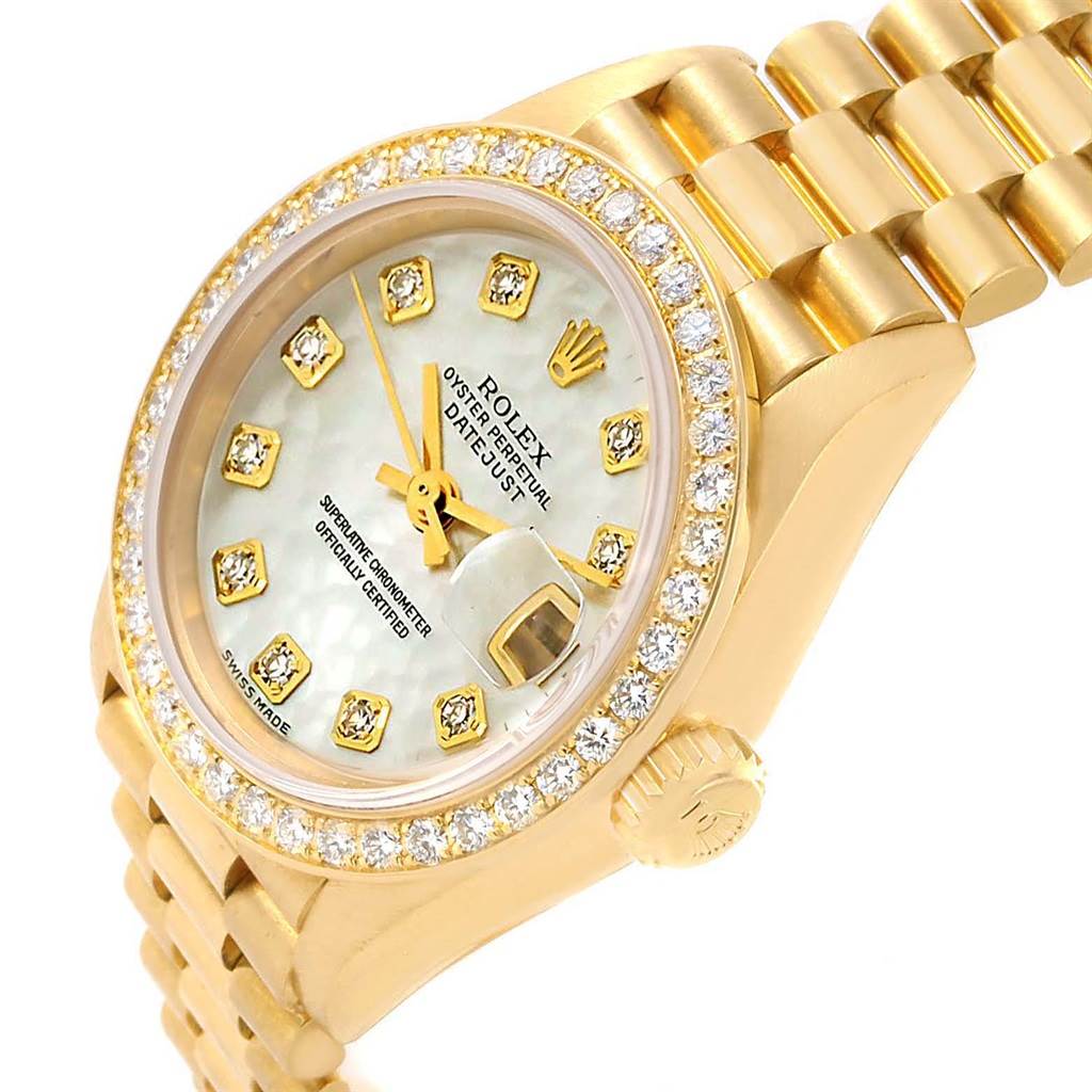 The image shows a Rolex President 79138 Women's Yellow Gold Mother of Pearl Dial 79138 Women's Yellow Gold Mother of Pearl Dial model watch at an angle showcasing the dial, bezel, and part of the bracelet.