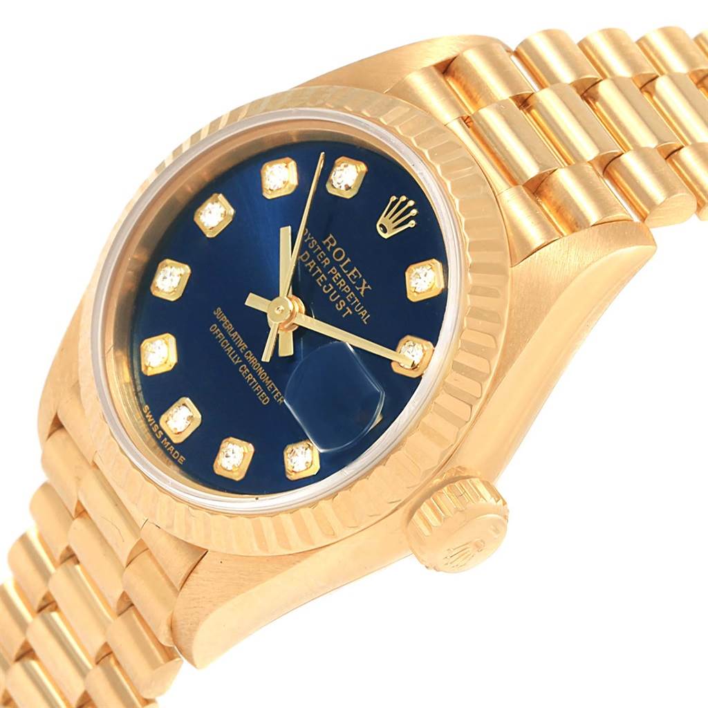The image shows a Rolex President 69178 Women's Yellow Gold Blue Dial 69178 Women's Yellow Gold Blue Dial model watch from a slight side angle, highlighting its blue dial and gold bracelet.